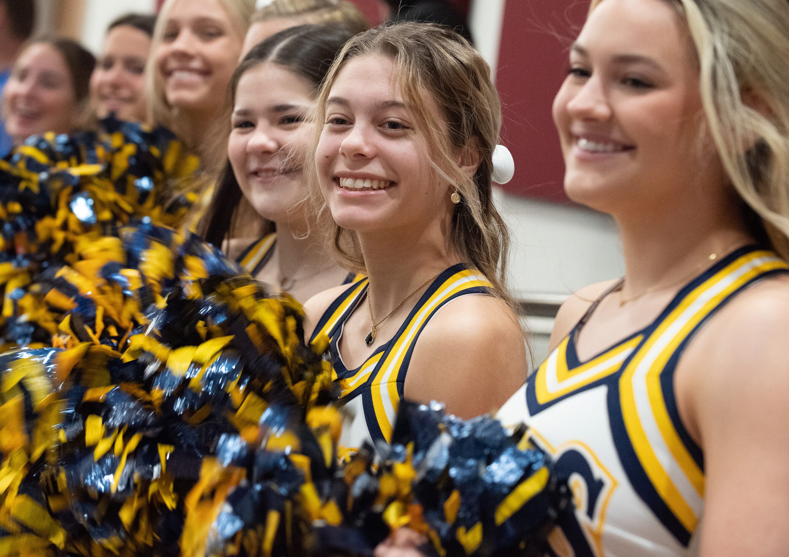 Students with the Highland Park Varsity cheerleaders, including Mary Frances Jones, left,...