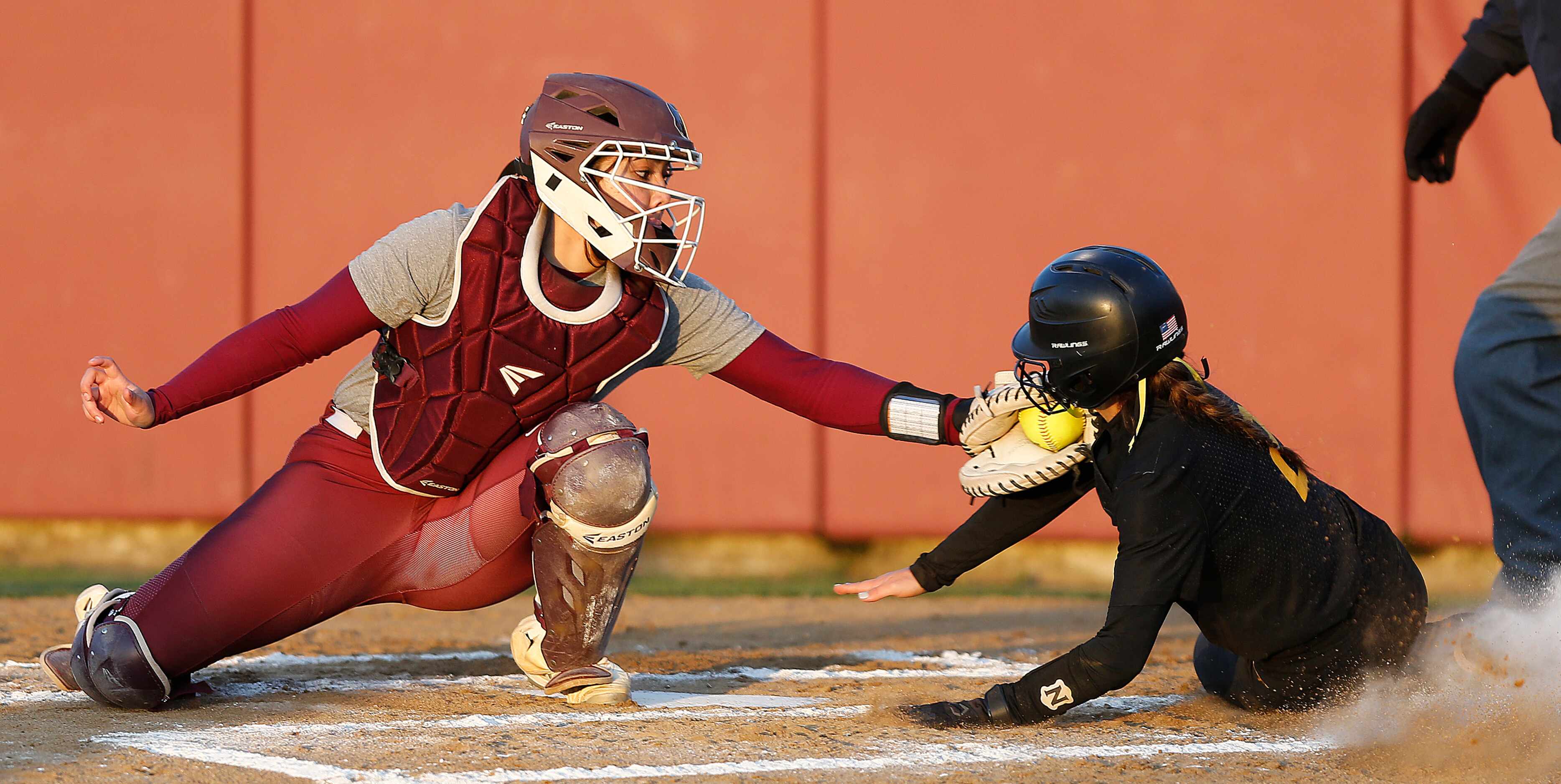 Heritage catcher Nadya Quezada (2) tags out Memorial’s second baseman Ashley Camacho (2) at...