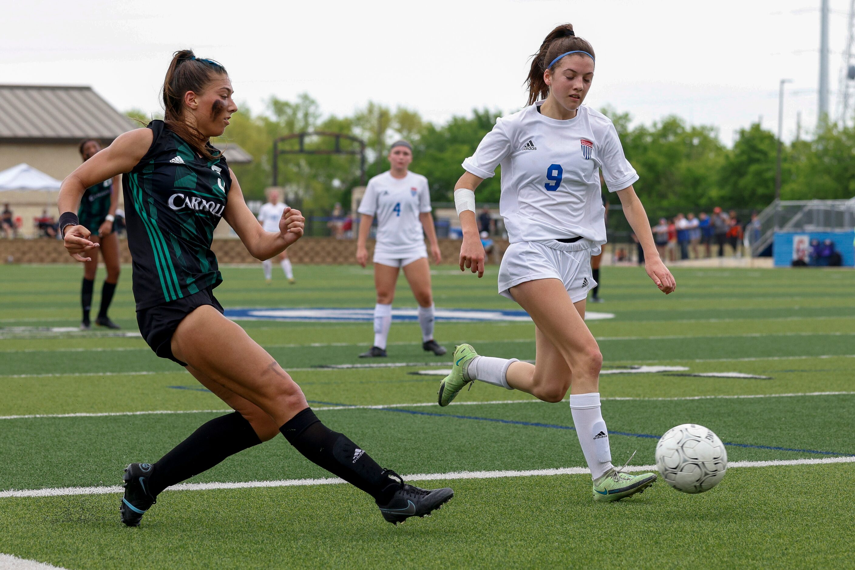 Southlake Carroll forward Madison Khan (5) passes the ball ahead of Austin Westlake defender...