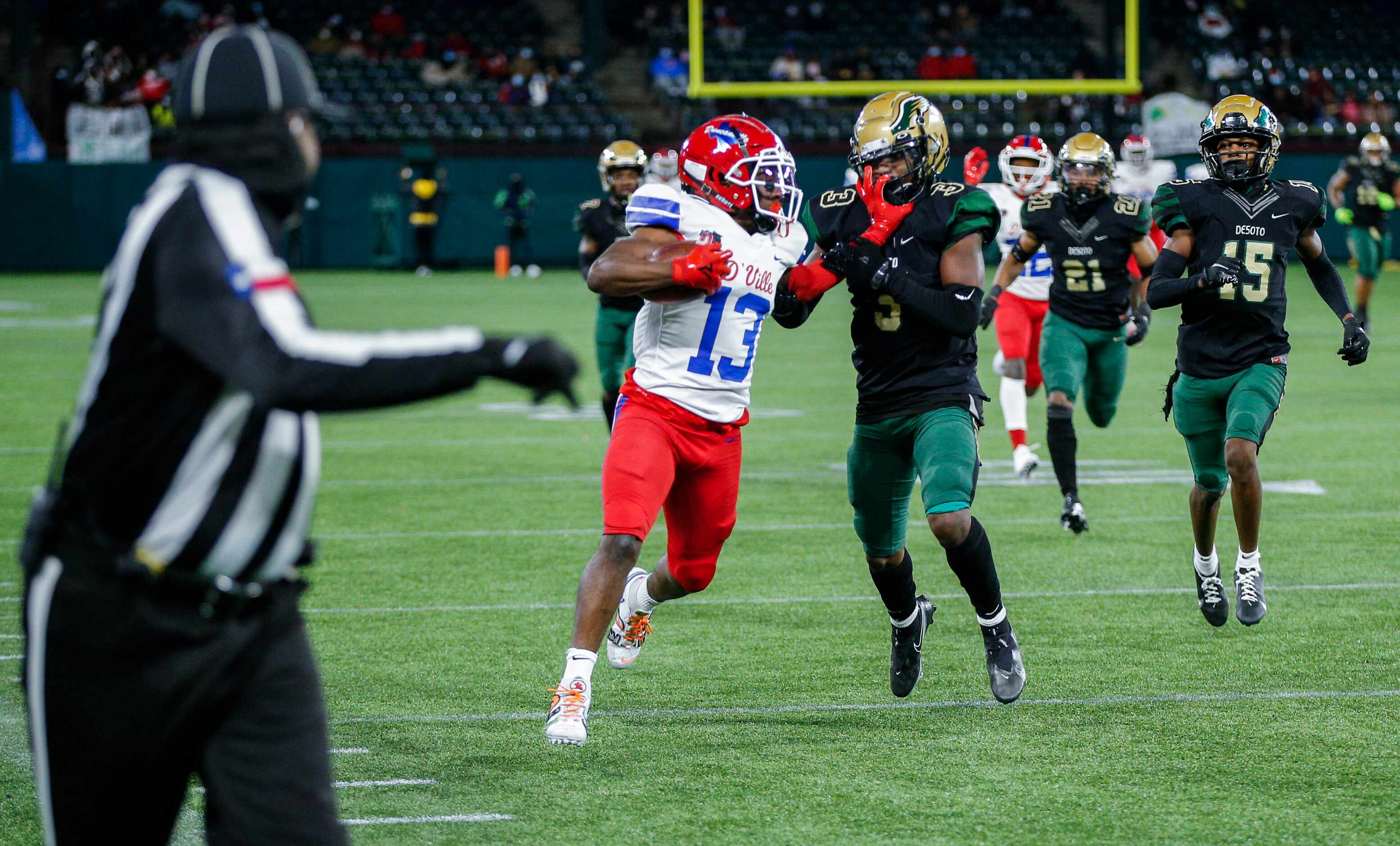 Duncanville senior running back Roderick Daniels Jr. (13) battles DeSoto junior safety Devyn...