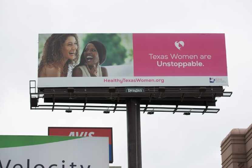 A billboard in downtown Austin touting the Healthy Texas Women program is an example of...
