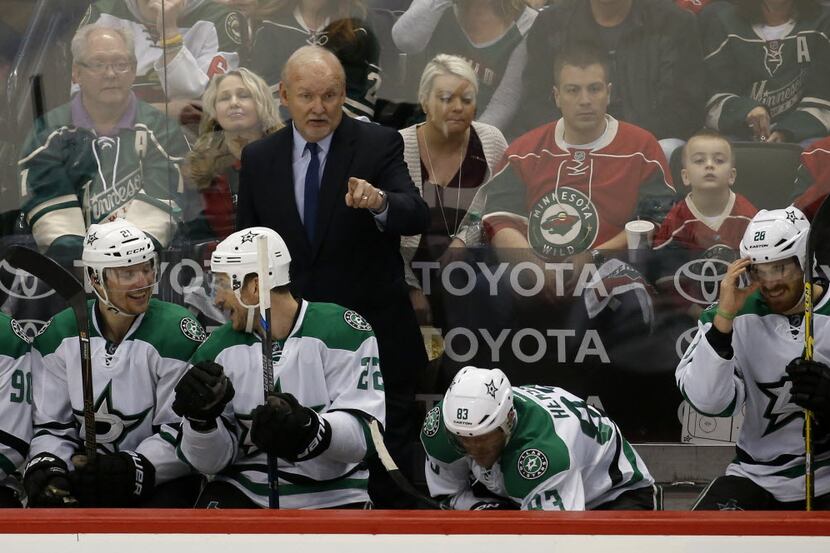 Dallas Stars head coach Lindy Ruff gestures to his players during the second period of Game...