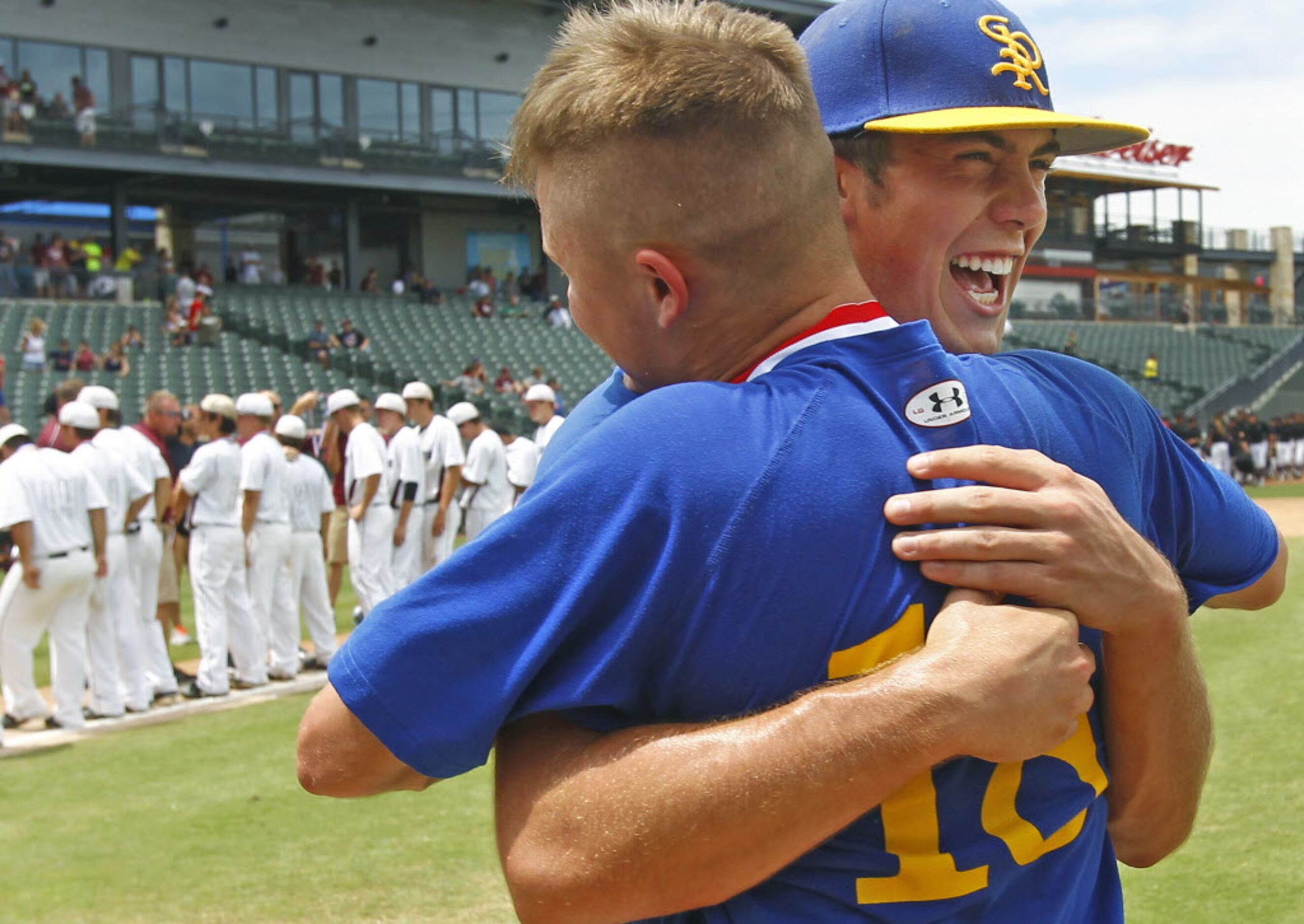 Sunnyvale's Sam Shaver (18) and Conner Mears hug as they celebrate their 13-3 championship...