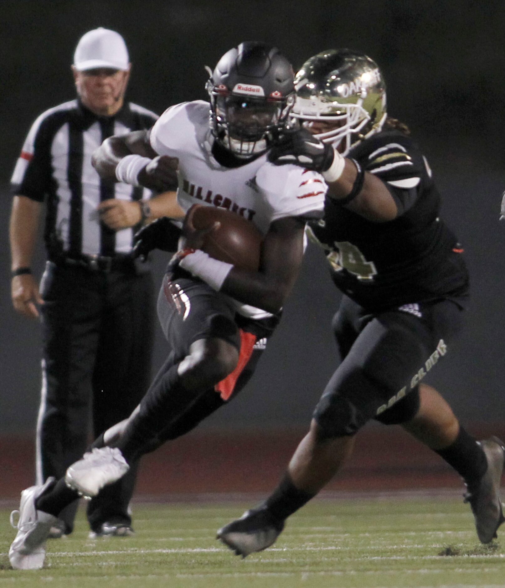 Dallas Hillcrest quarterback Carter Sido (1) bolts into the secondary on a keeper as South...