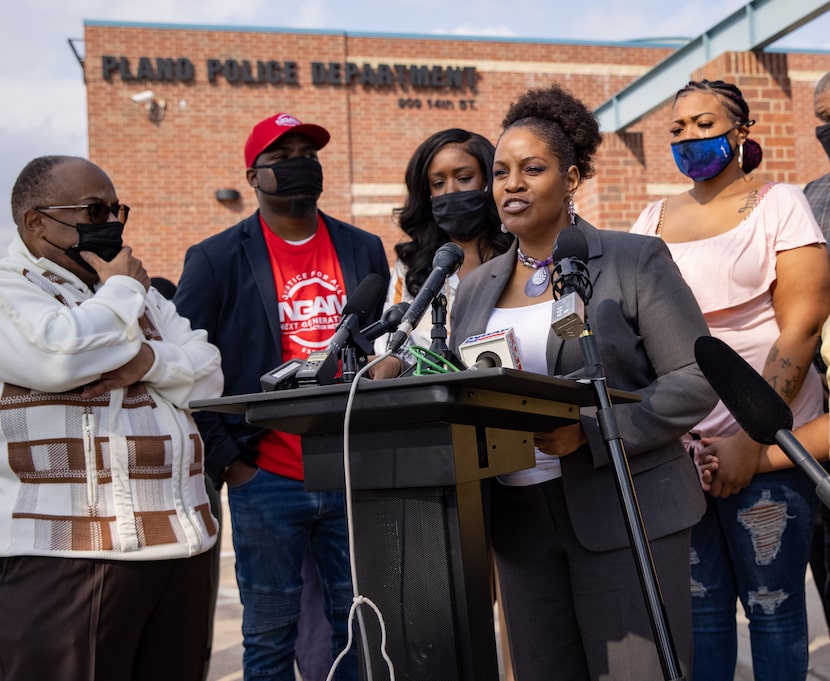 Summer Smith (right) cried as she held the hand of her son while listening to attorney Kim...