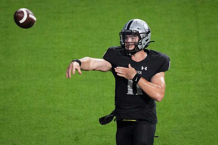 Denton Guyer quarterback Jackson Arnold (11) throws a pass during the first half of a high...