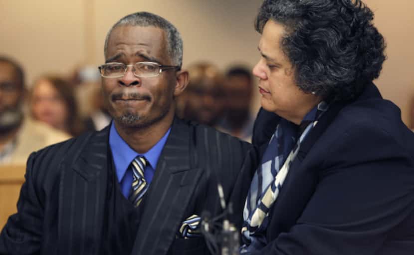 Richard Miles is comforted Wednesday by attorney Cheryl Wattley in 2012 as State District...