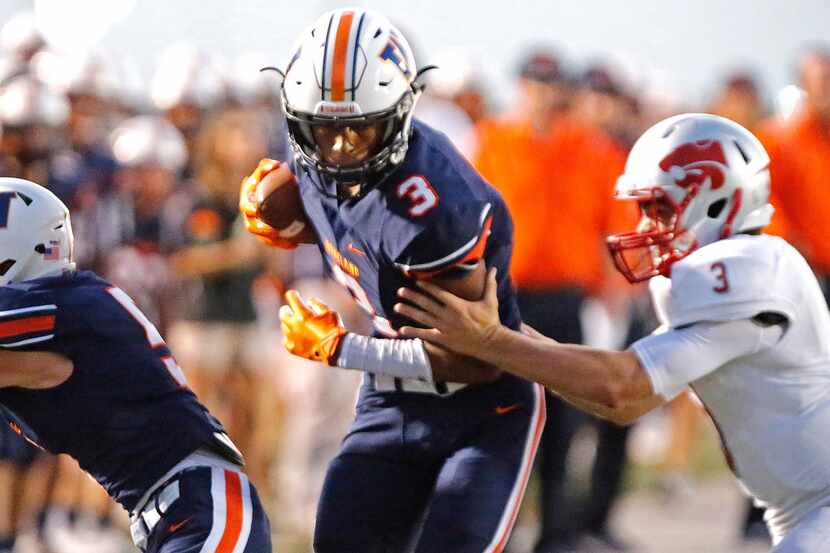Wakeland High School wide receiver Tre Adams (3) is pushed out of bounds by Woodrow Wilson...