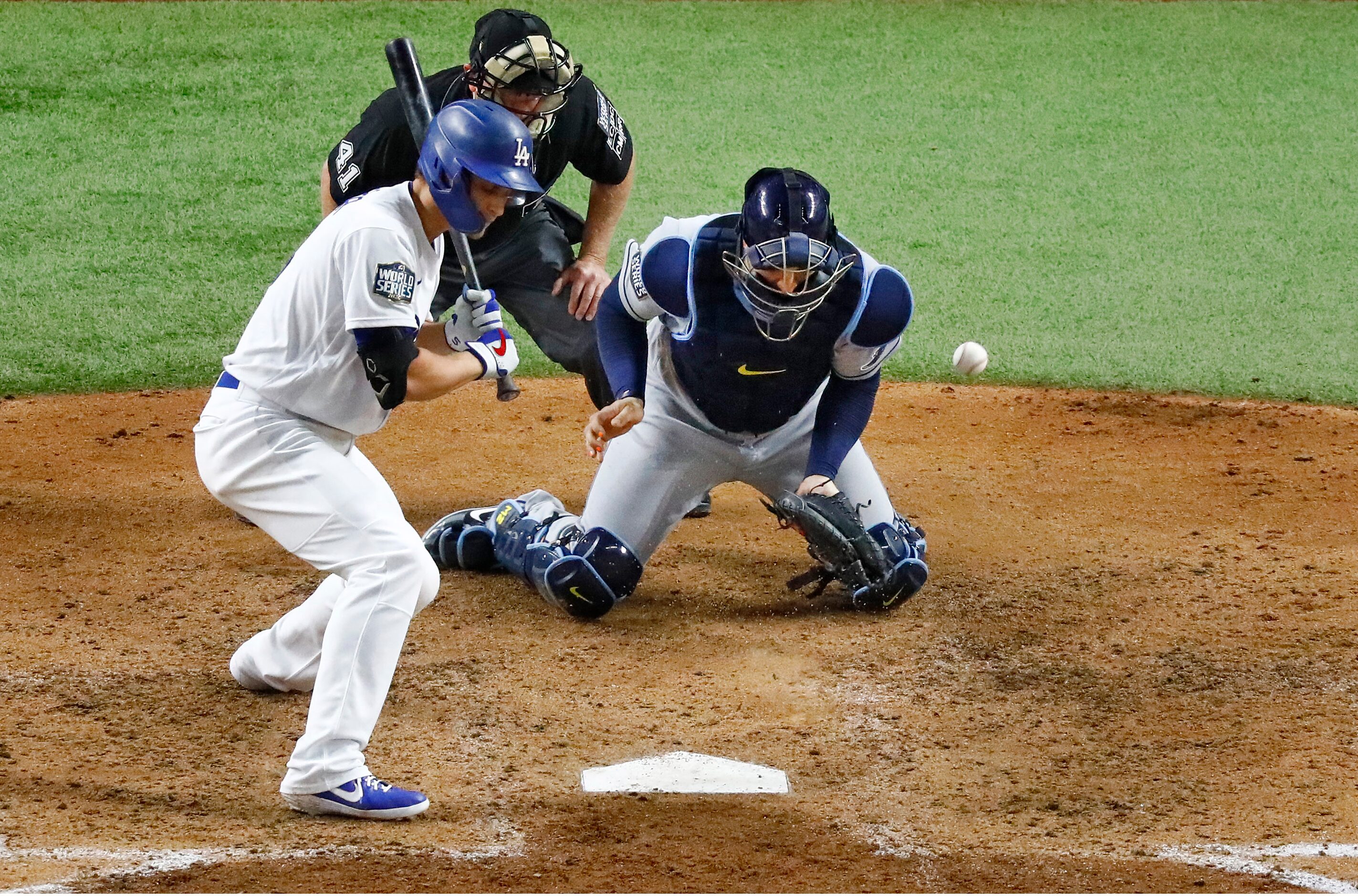 A wild pitch gets away from Tampa Bay Rays catcher Mike Zunino (10) as Los Angeles Dodgers...