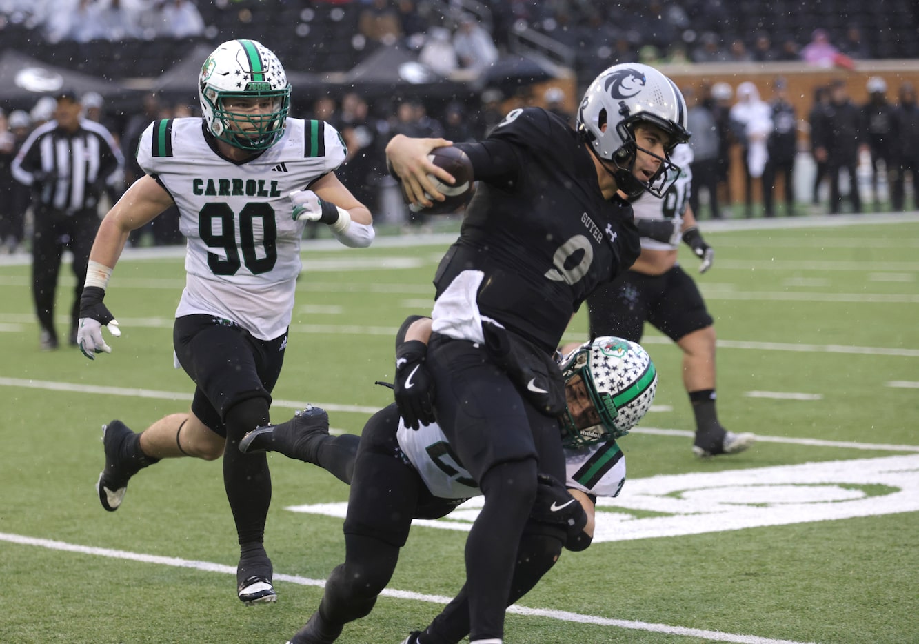 Denton Guyer's Kevin Sperry (9) runs for the sideline to avoid a sack during the Class 6A...