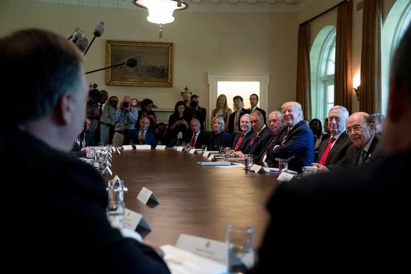 In this June 2017, file photo, President Donald Trump laughs during a Cabinet meeting in the...