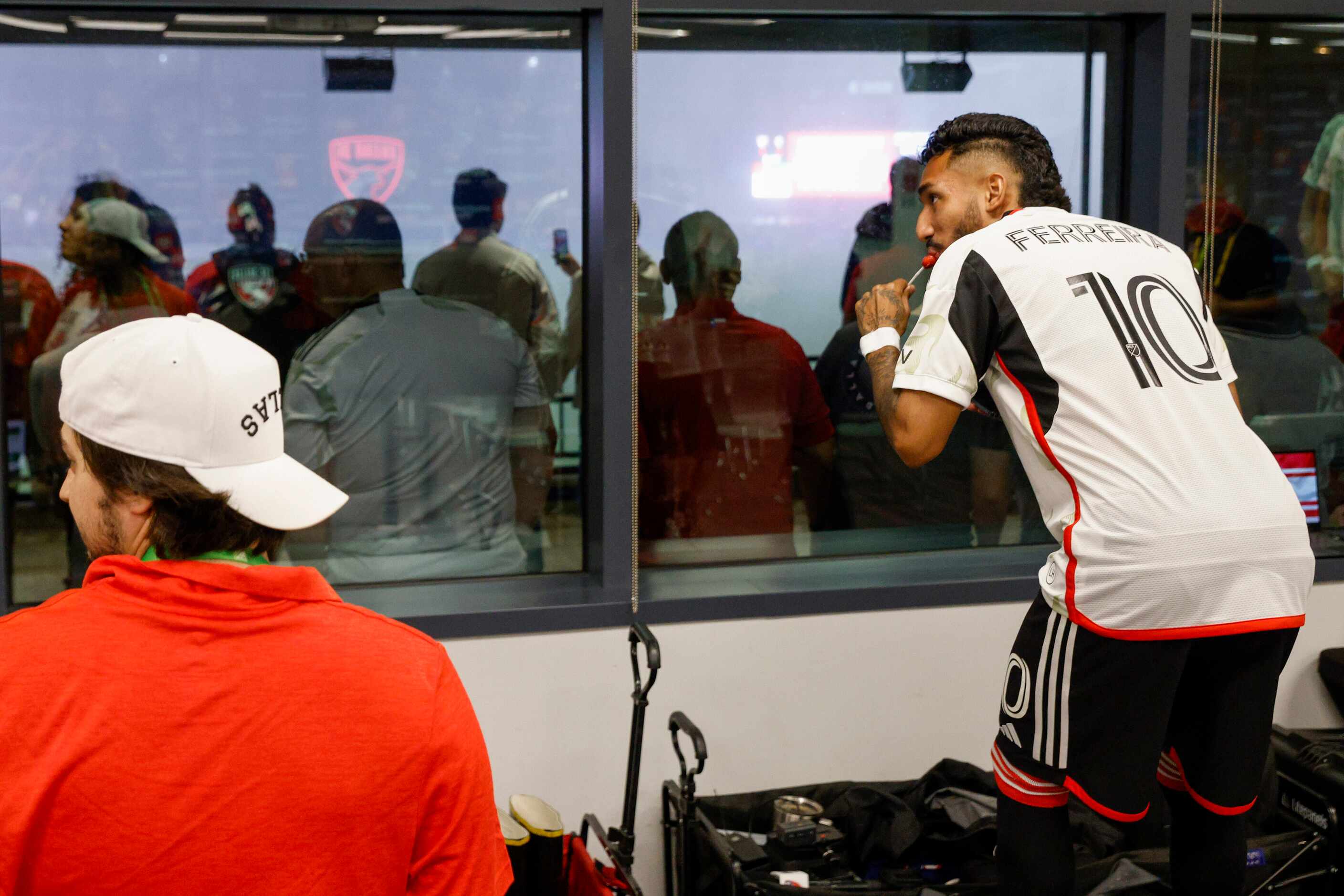 FC Dallas forward Jesús Ferreira (10) watches a thunderstorm from the media interview room...