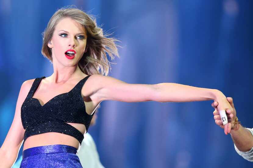 Musical artist Taylor Swift sings during her performance at AT&T Stadium in Arlington, on...