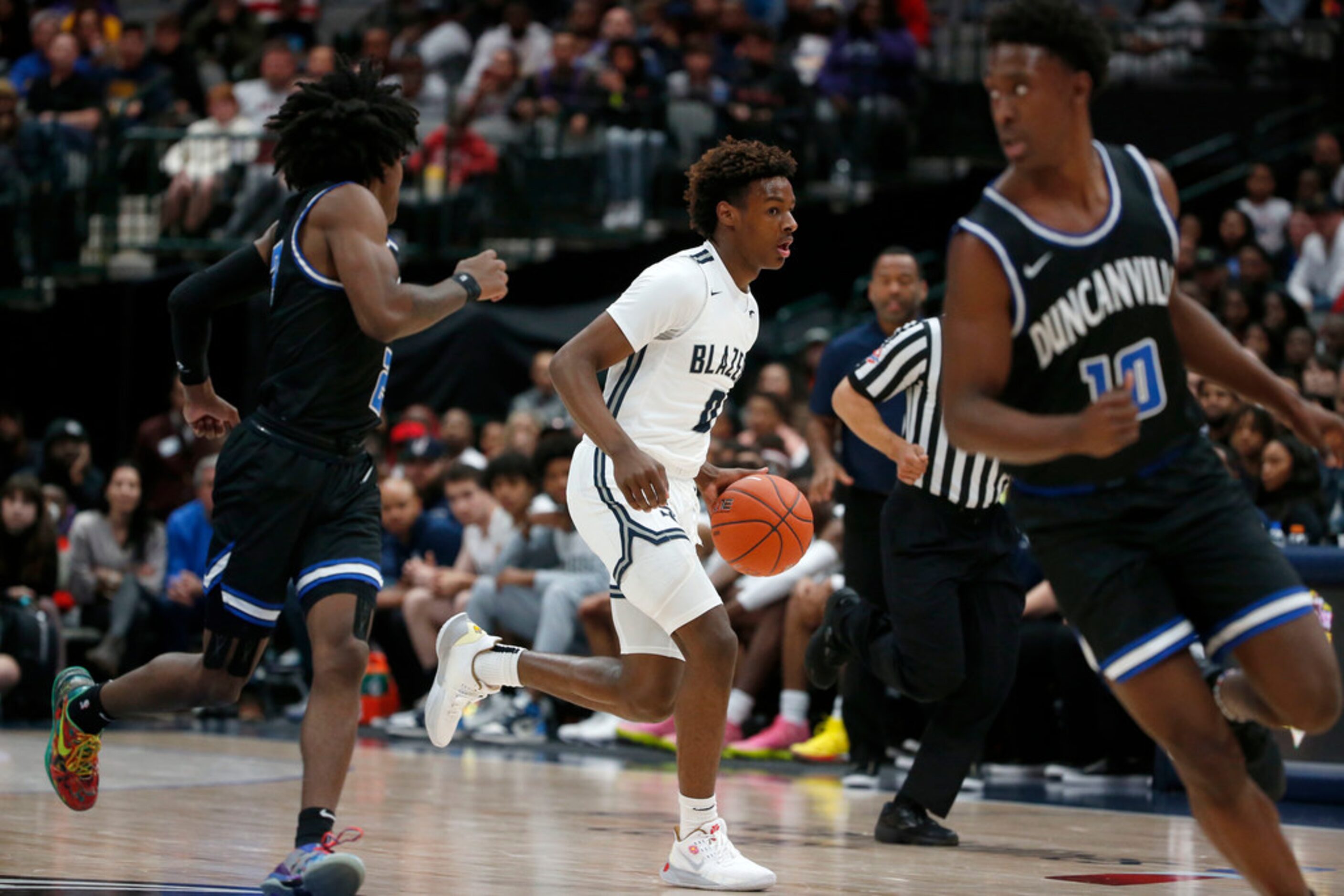 Sierra Canyon's  Bronny James ()) dribbles against Duncanville during their high school boys...