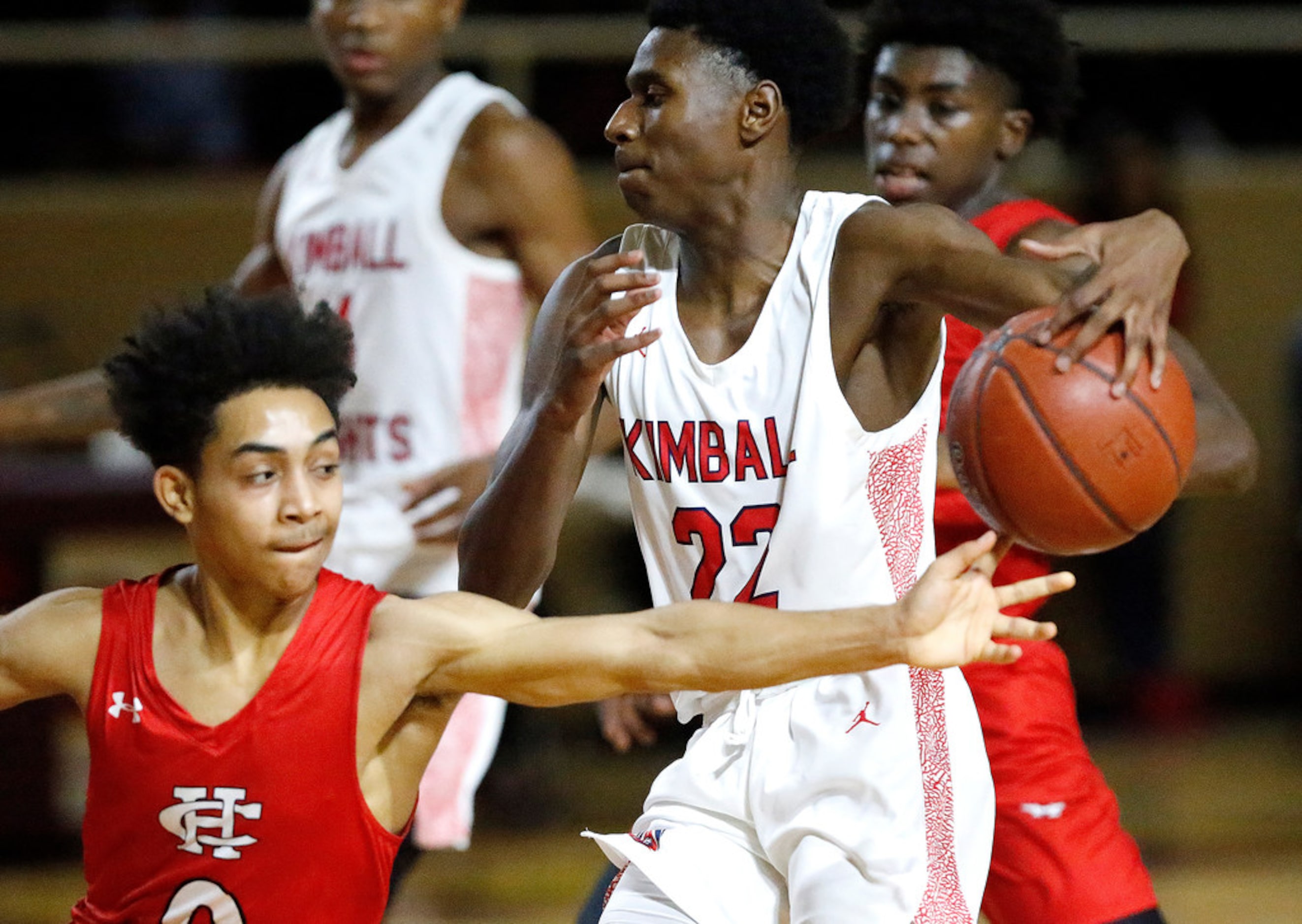 Kimball High School guard Jamari Lawrence (22) has the ball stolen by  Cedar Hill High...