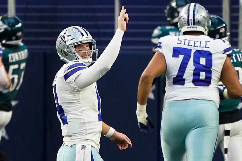 Dallas Cowboys quarterback Andy Dalton (14) celebrates after throwing a touchdown  pass to...