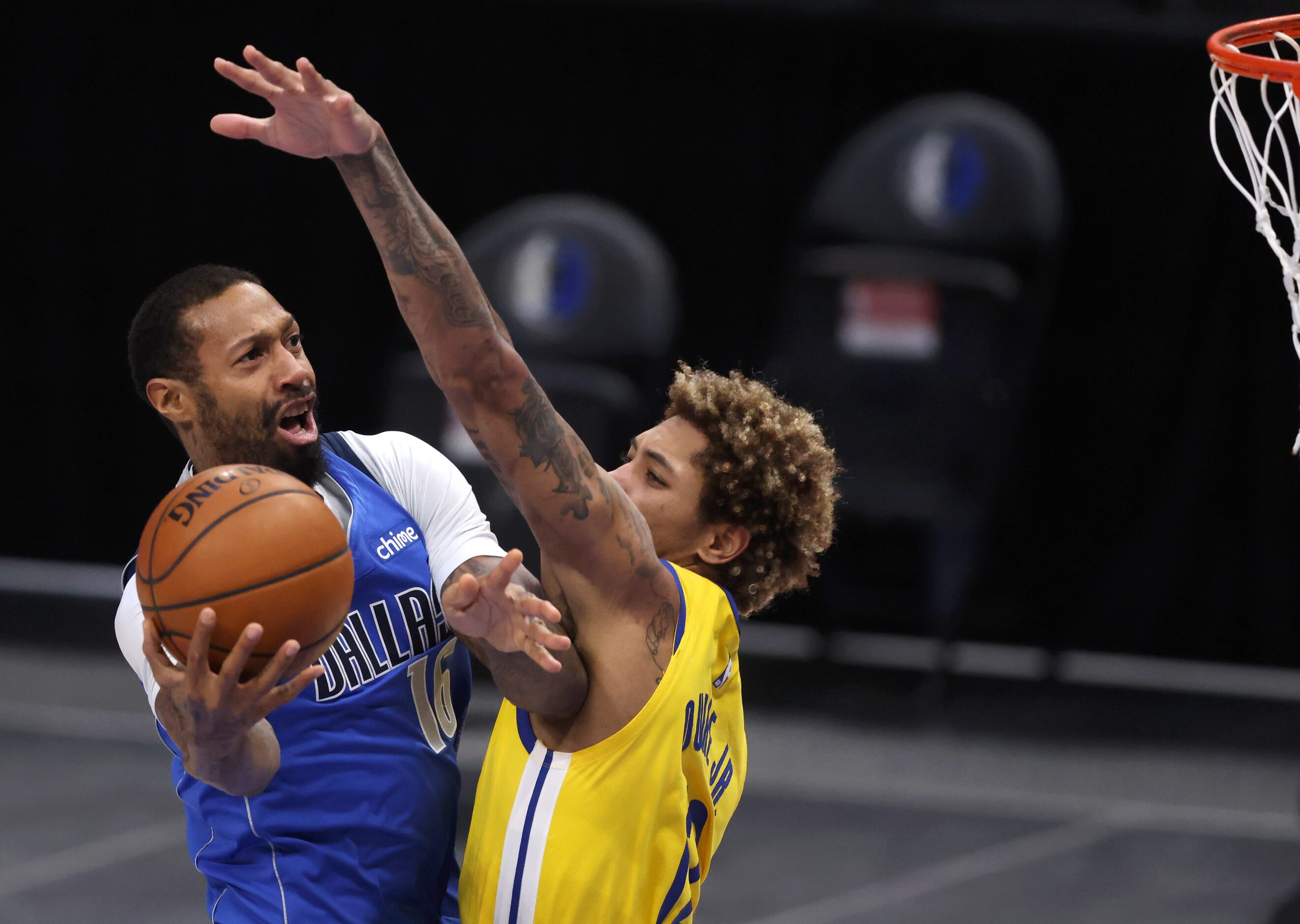 Dallas Mavericks forward James Johnson (16) attempts a shot in front of Golden State...