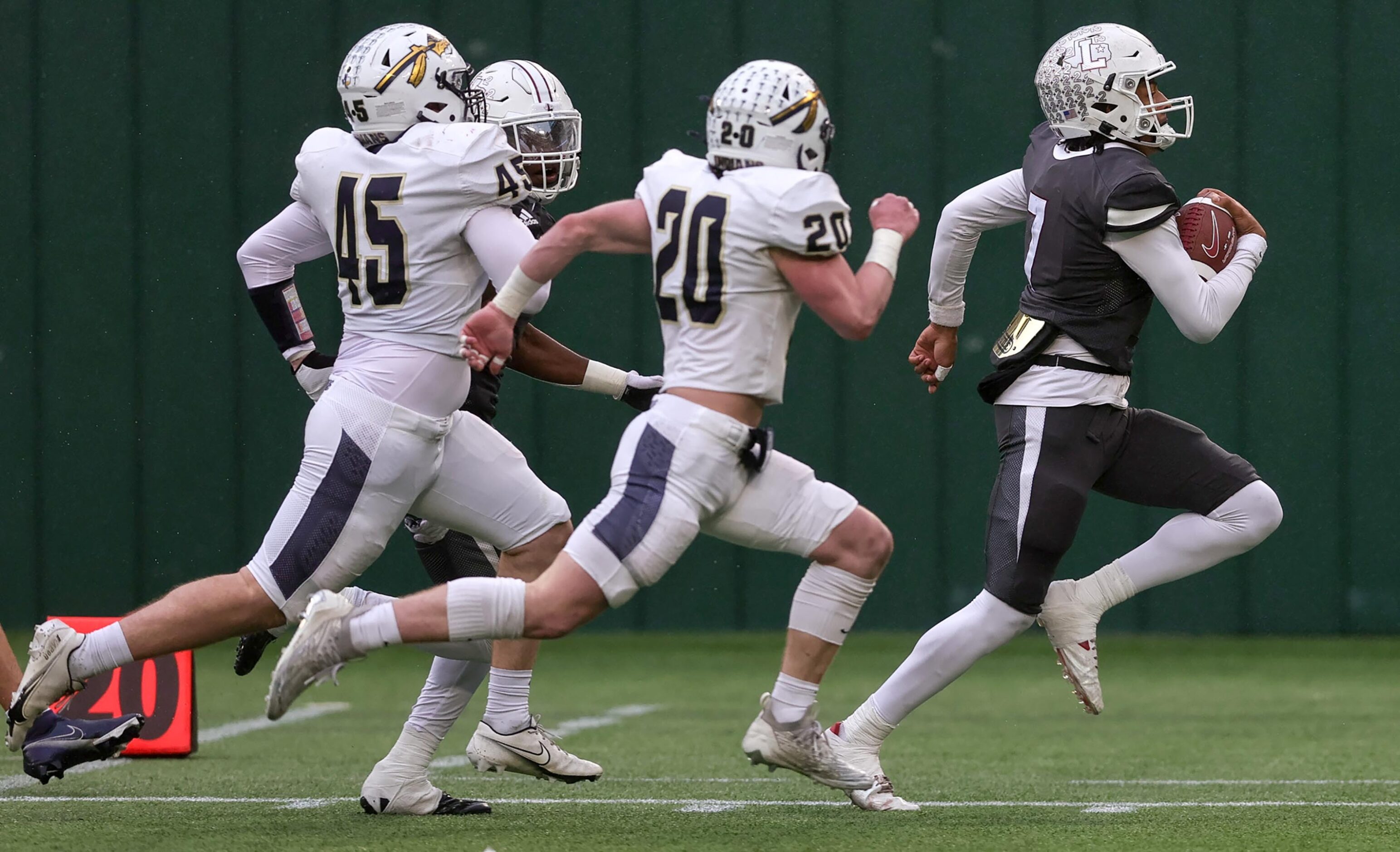 Lewisville quarterback Ethan Terrell (7) races down the sideline from the Keller defense for...