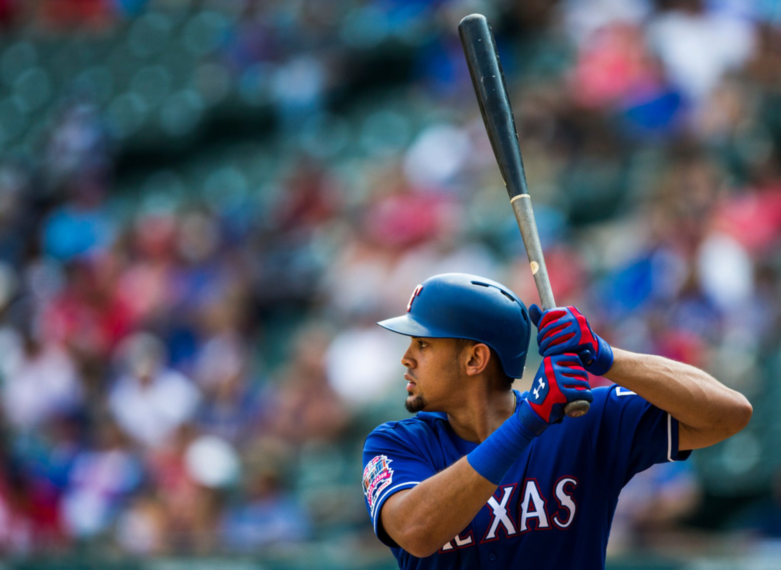 Texas Rangers first baseman Ronald Guzman (11) bats during the eighth inning of an MLB game...