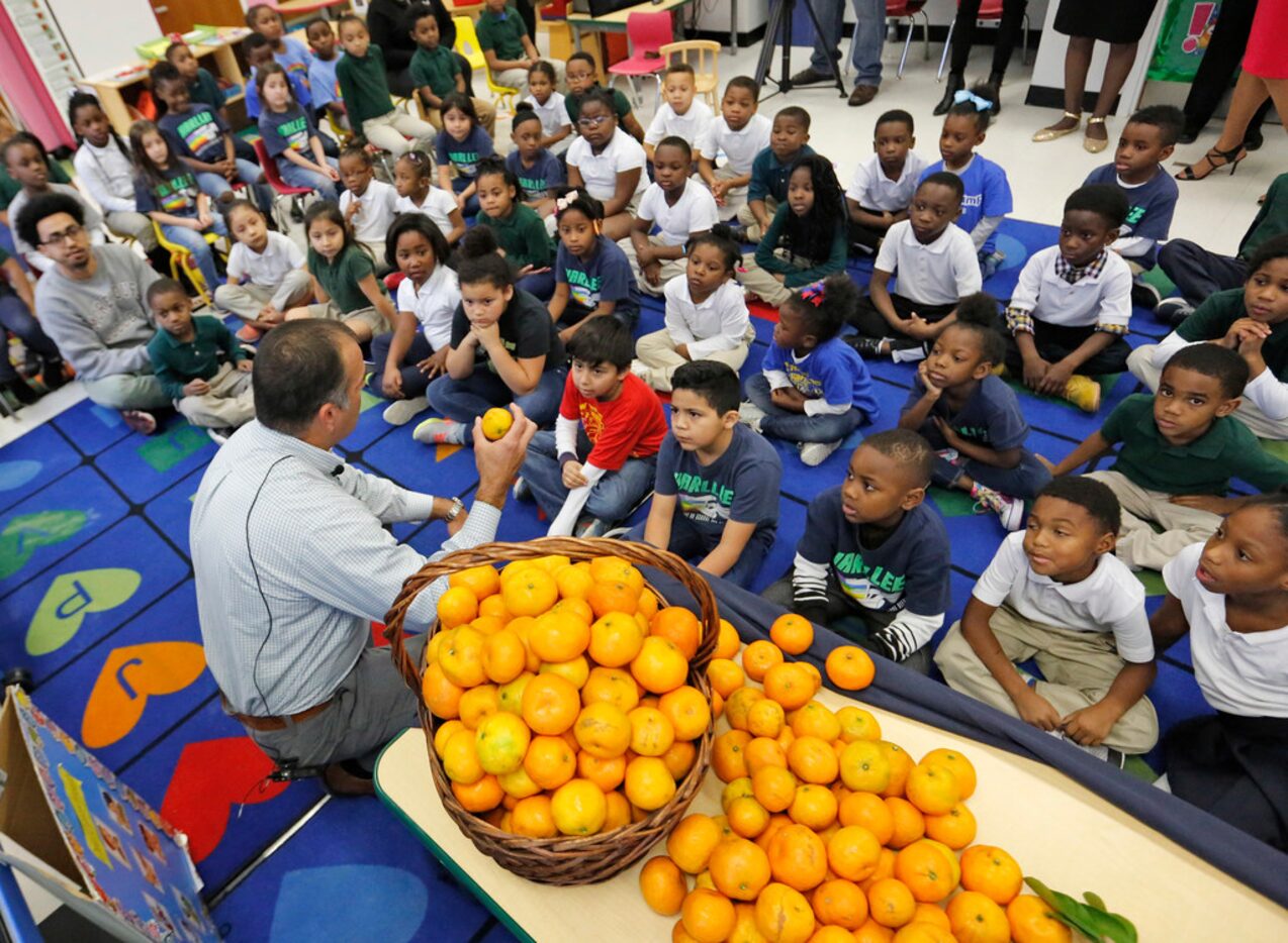 Farmer Christopher Sturdivant of Alvin, near Houston, talks with students at N.W. Harllee...