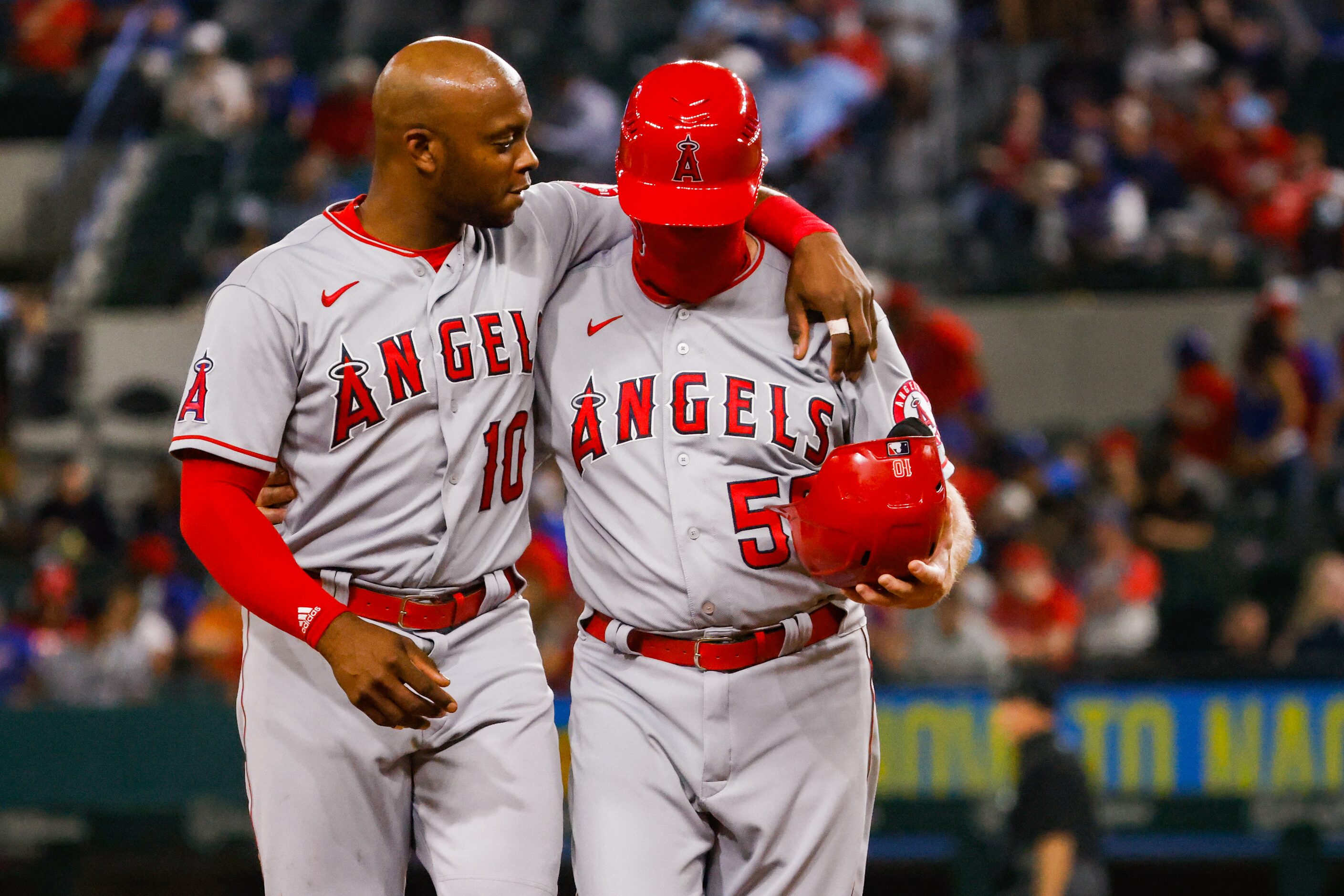 Los Angeles Angels left fielder Justin Upton (10) and Los Angeles Angels infield/third base...