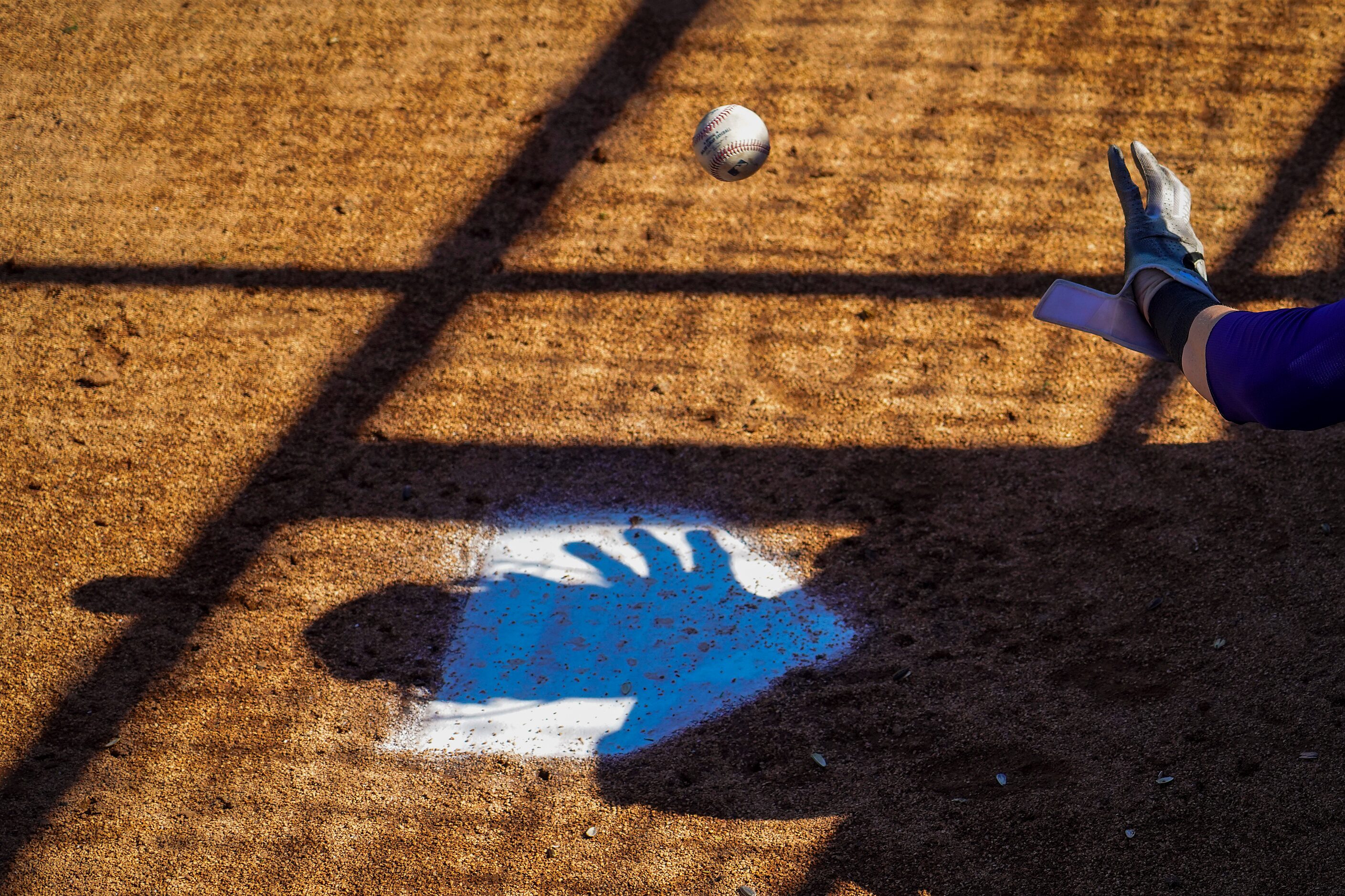 Texas Rangers catcher Sam Huff warms up in the bullpen during the sixth inning of a spring...