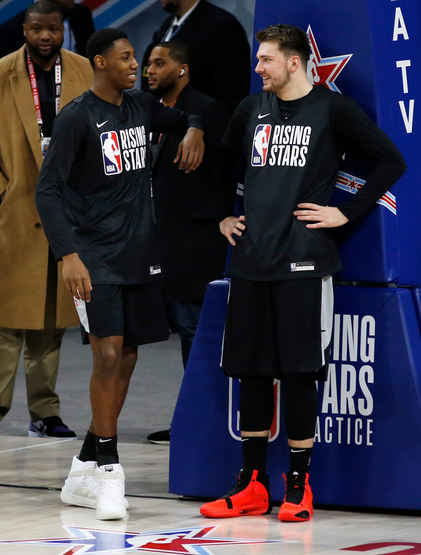 Dallas Mavericks forward Luka Doncic (77) and New York Knicks guard RJ Barrett talk after...