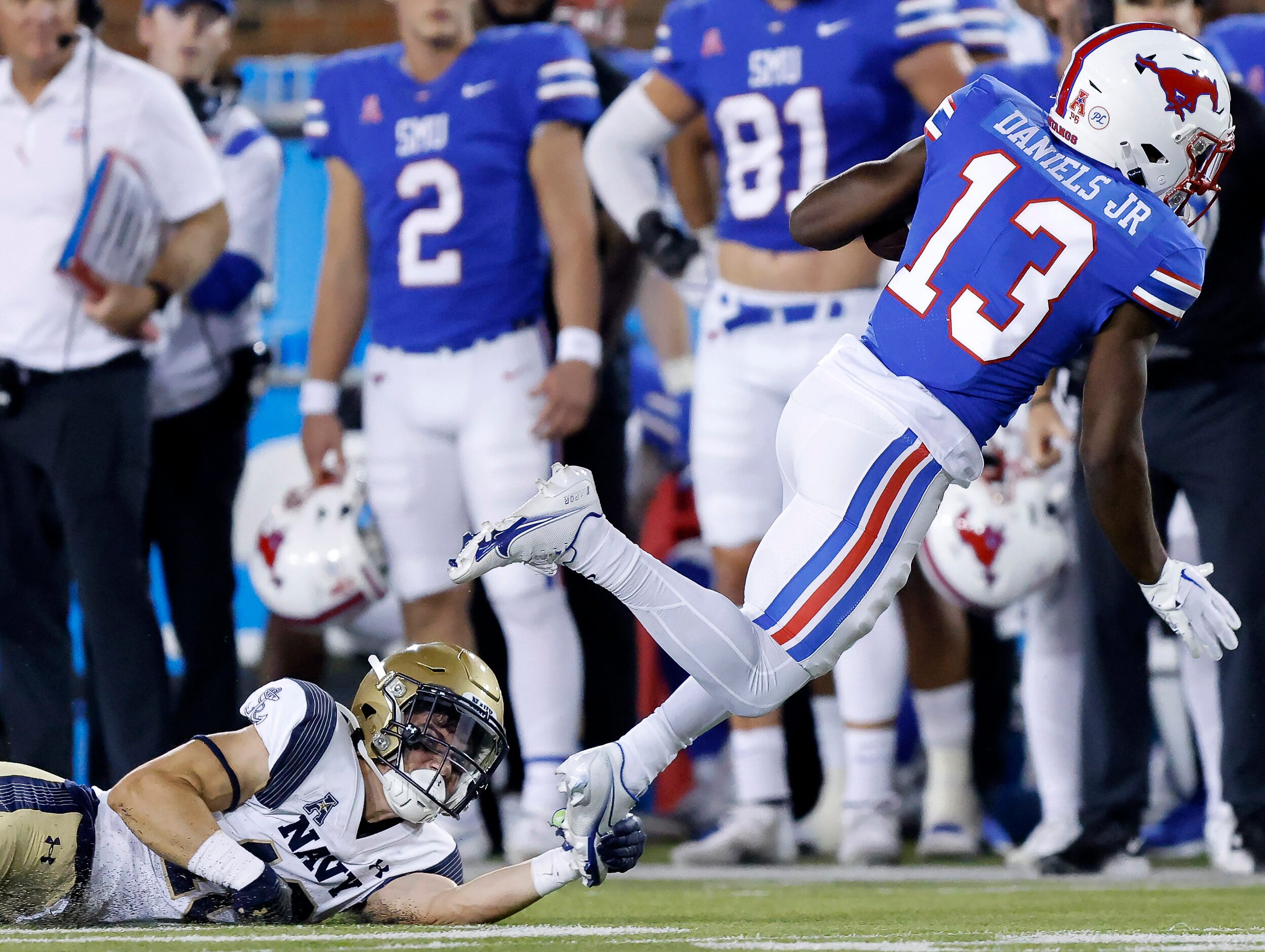 Navy Midshipmen linebacker Joe Hutson (16) saves a possible breakaway by tacking Southern...