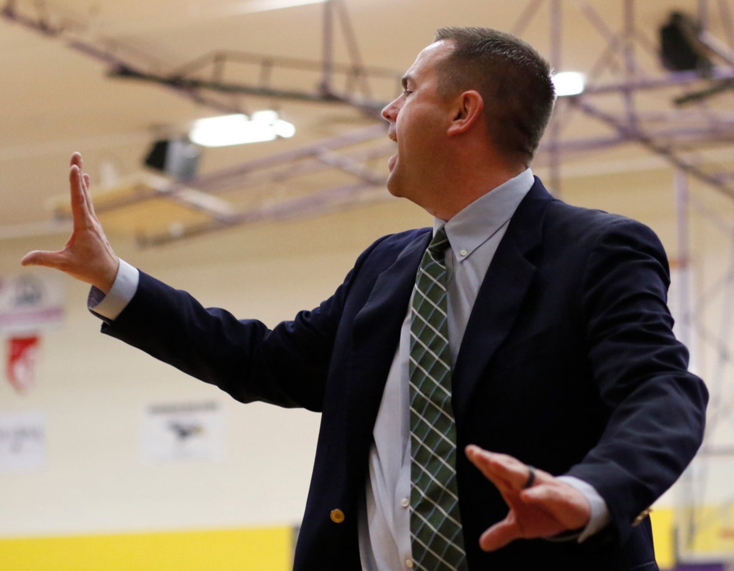 Richardson Berkner head coach Jason Petty works to deliver a message to his players during...