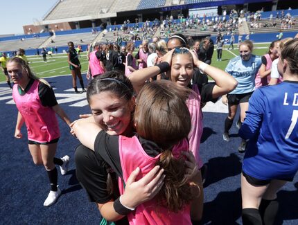 Southlake Carroll players celebrate after winning during a Class 6A Region I championship...