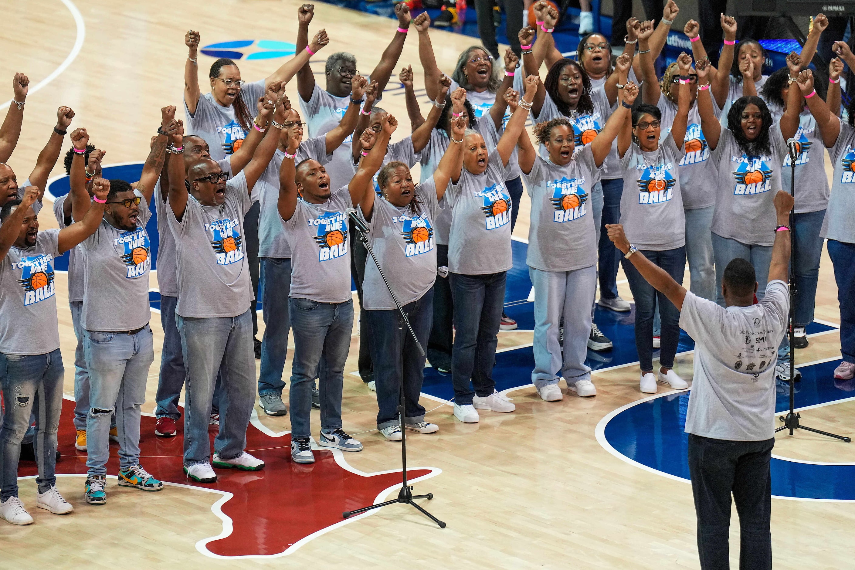 Members of the Project Unity Choir sing “Life Every Voice and Sing” before the 8th Annual...