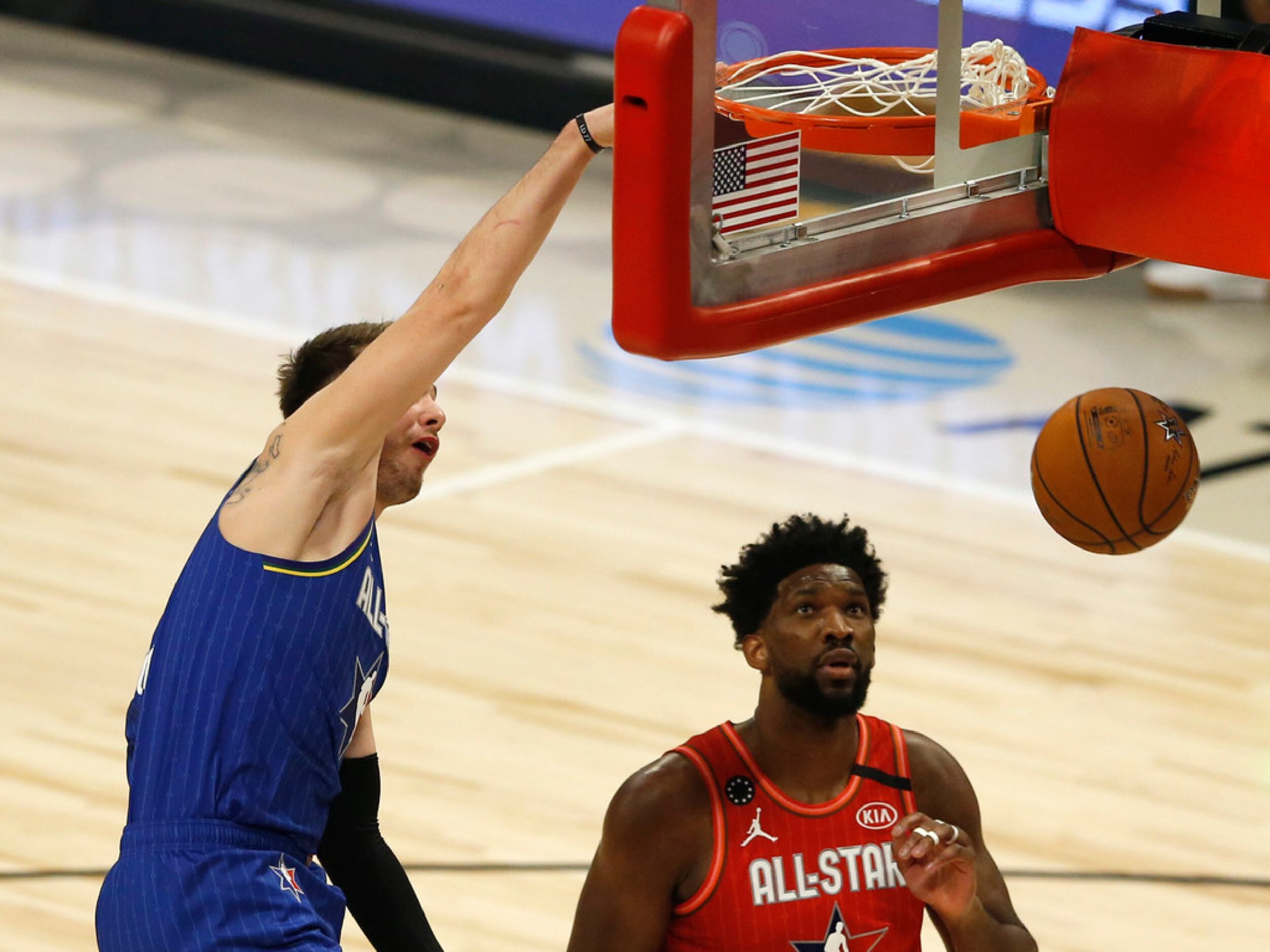 Team LeBron's Luka Doncic (2) dunks the ball in front of Team Giannis's Joel Embid (24)...