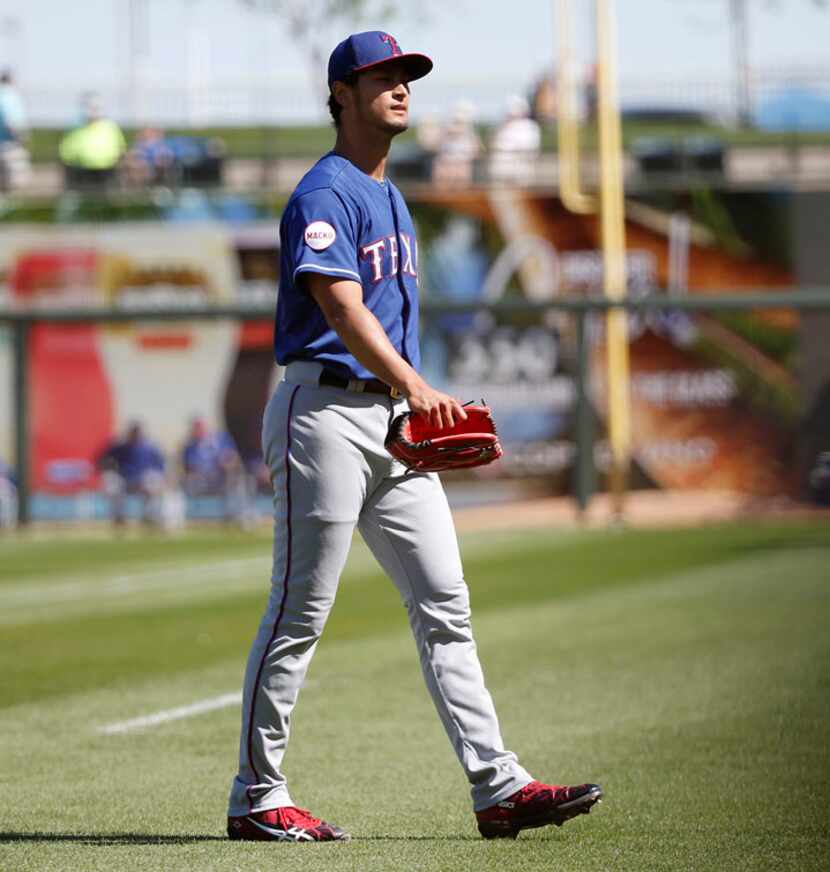  Texas Rangers pitcher Yu Darvish leaves the mound after the first inning during a Major...