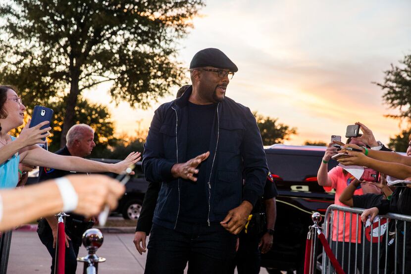 Tyler Perry greets fans on a red carpet before a screening of his film Boo 2! A Madea...