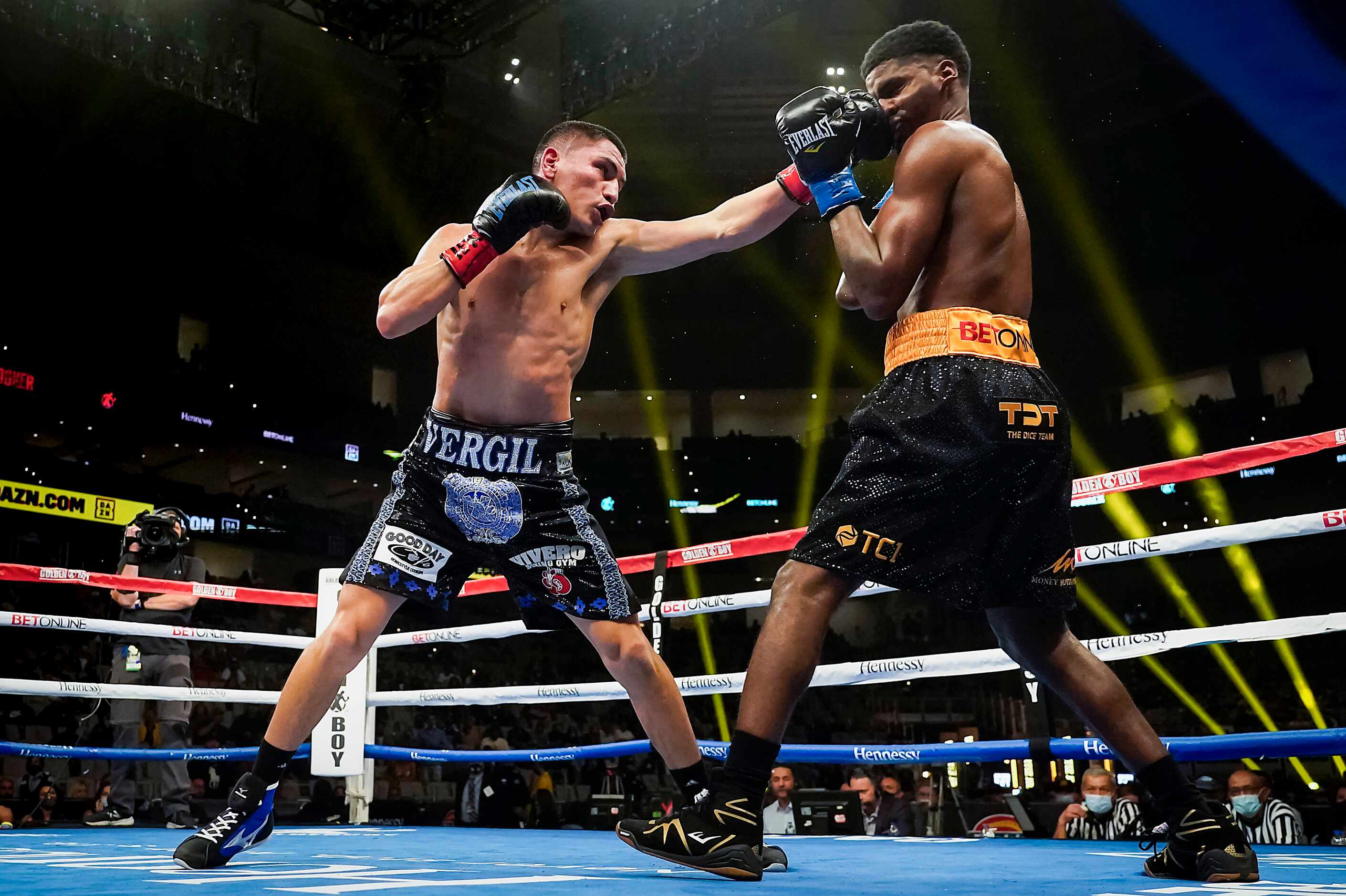 Vergil Ortiz Jr. (left) lands a punch to the face of Maurice Hooker as they fight for the...