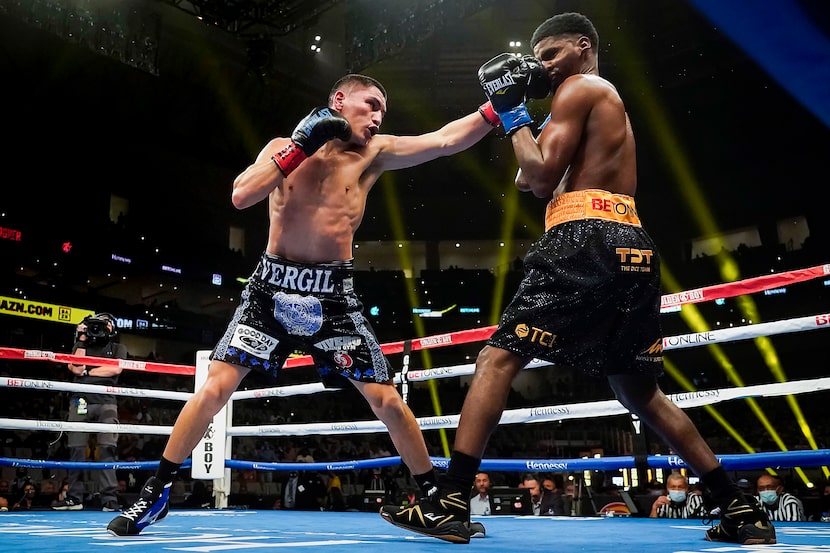 Vergil Ortiz Jr. (left) lands a punch to the face of Maurice Hooker as they fight for the...