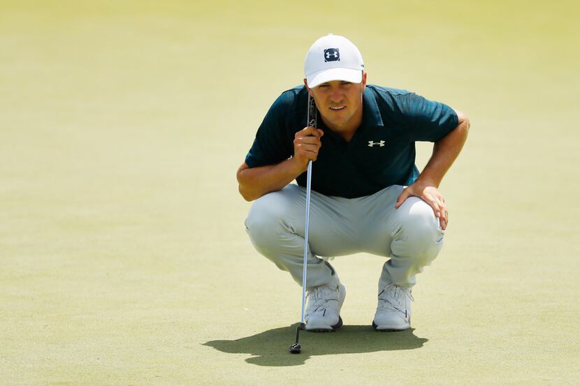 JERSEY CITY, NEW JERSEY - AUGUST 11: Jordan Spieth of the United States lines up a putt on...