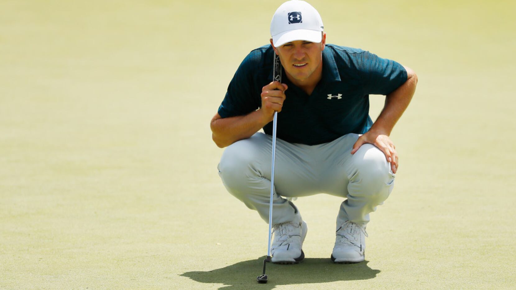 JERSEY CITY, NEW JERSEY - AUGUST 11: Jordan Spieth of the United States lines up a putt on...