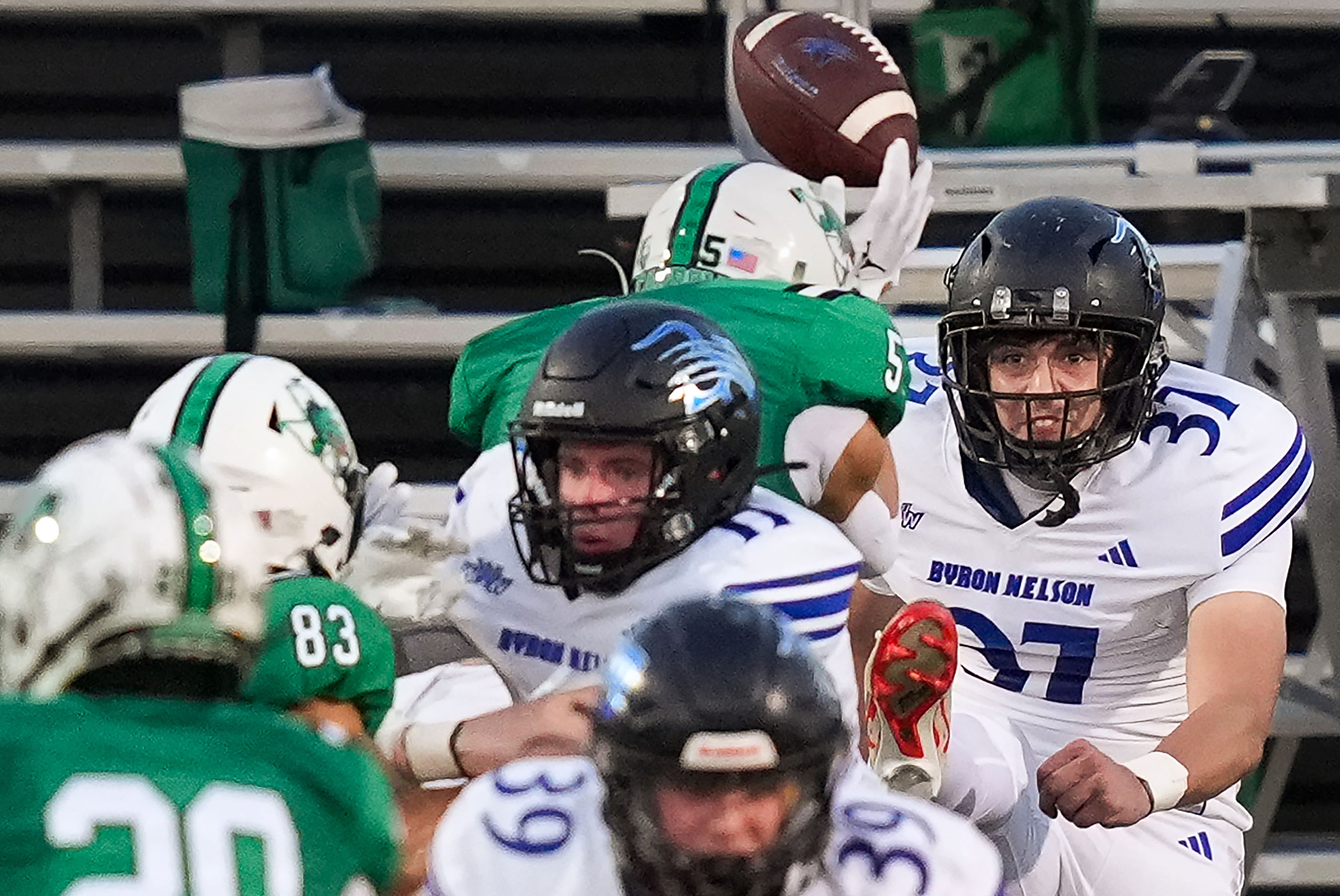 Trophy Club Byron Nelson punter Arijan Lajqi (37) has a punt blocked by Southlake Carroll’s...