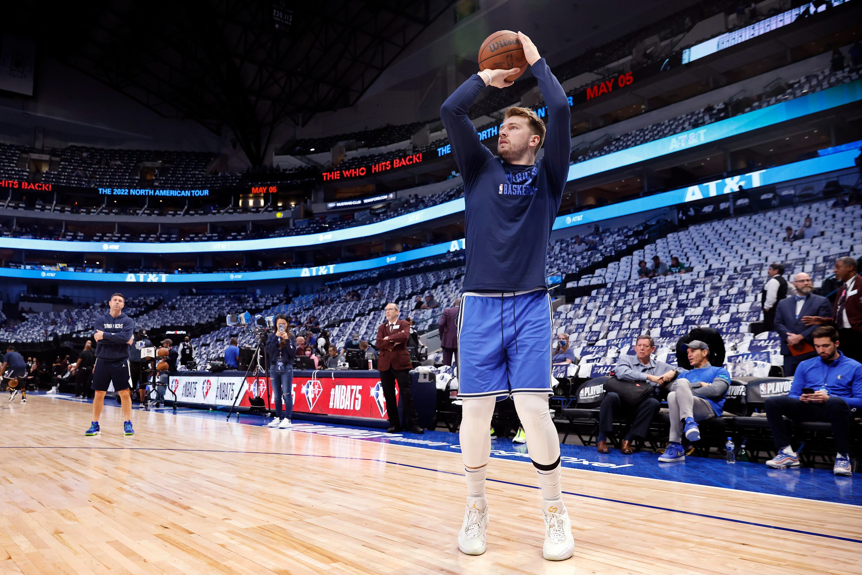 Dallas Mavericks guard Luka Doncic takes shots on his injured calf during warms up before...