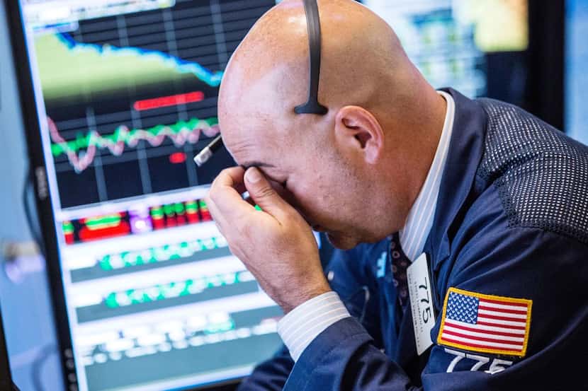 
A trader on the floor of the New York Stock Exchange looked weary as the major indexes fell...