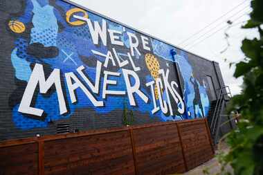 A Dallas Mavericks mural by artists Abby Newland and Chris Bingham located behind the 7-11...