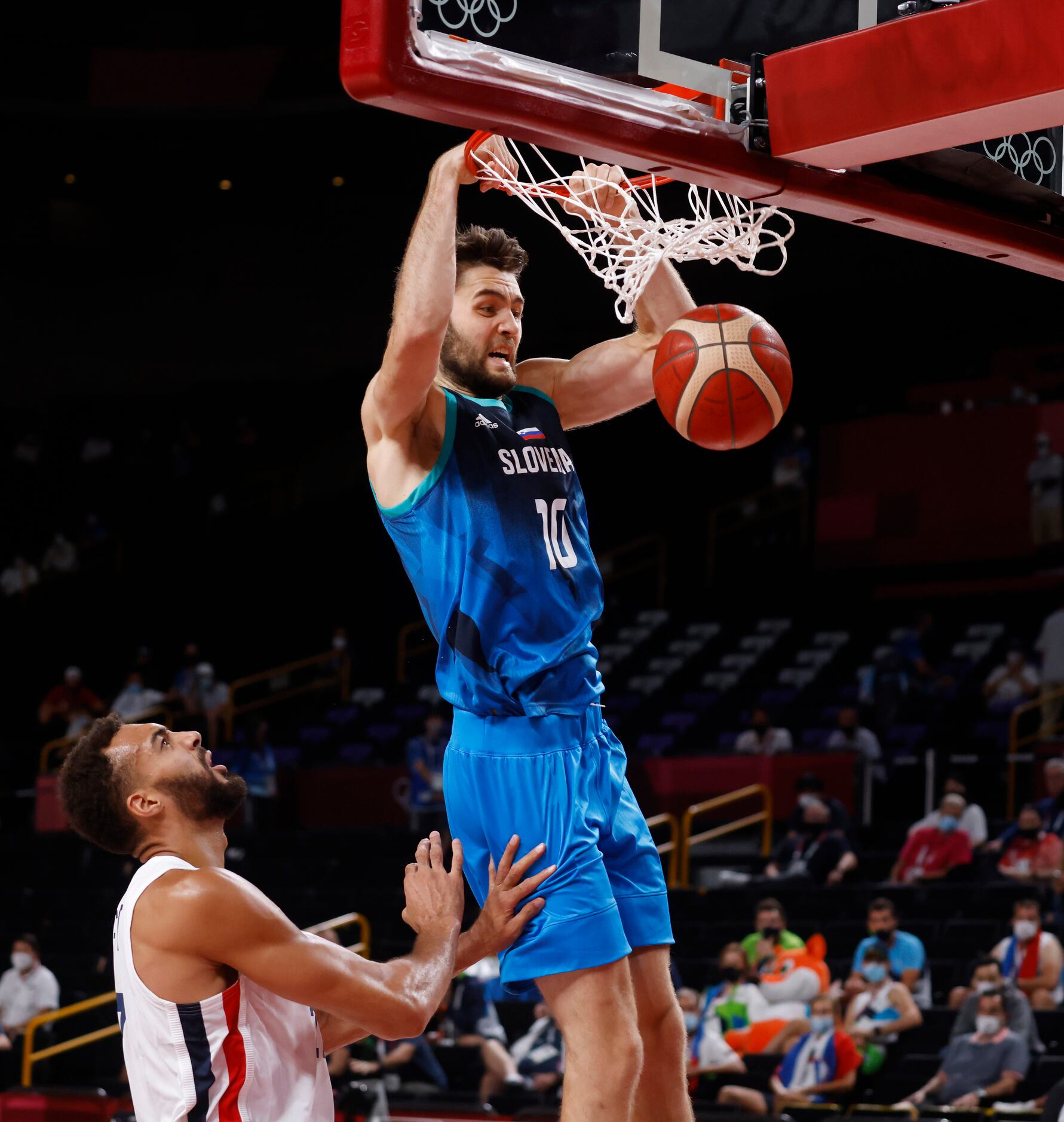 Slovenia’s Mike Tobey (10) dunks the ball in front of France’s Rudy Gobert (27) during the...