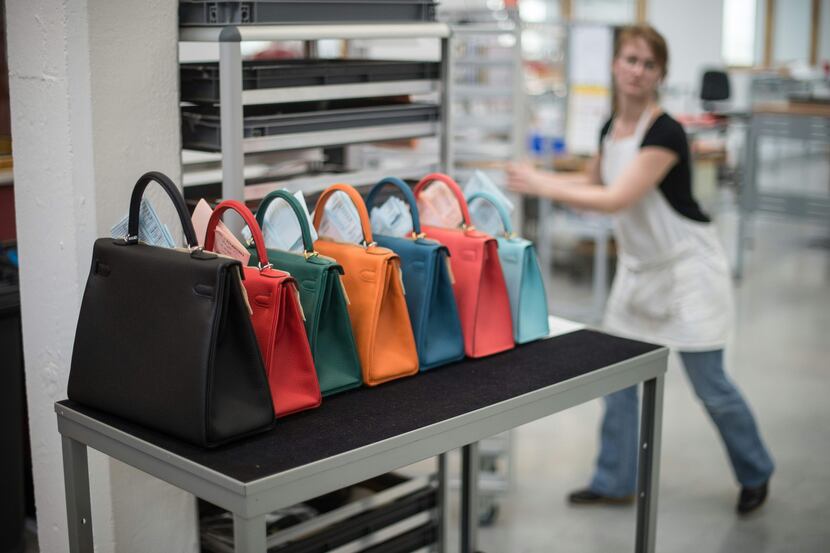 In this file photo taken in 201,6 a woman works in the Hermes workshop on the eve of the...