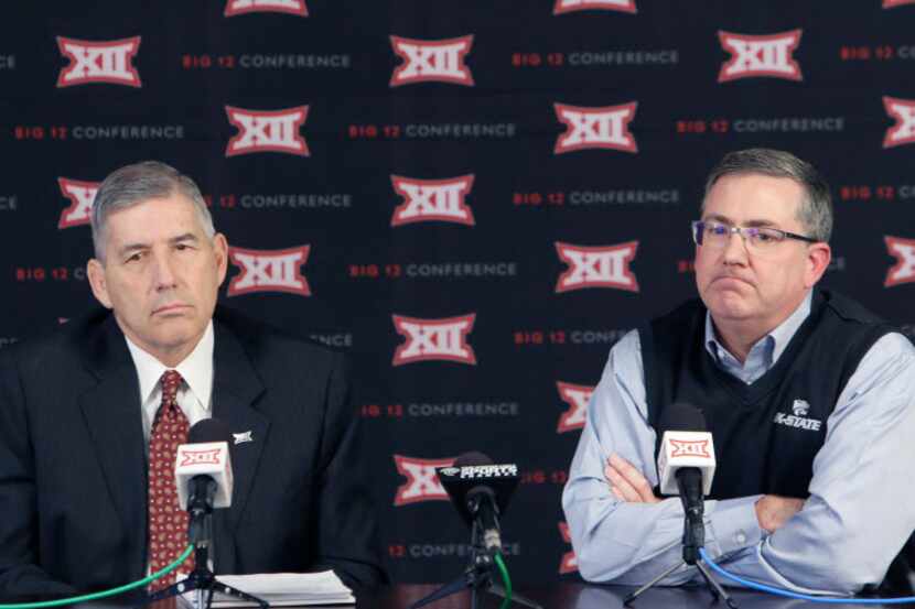 Big 12 commissioner Bob Bowlsby, left, and Kansas State president Kirk Schulz listen to a...