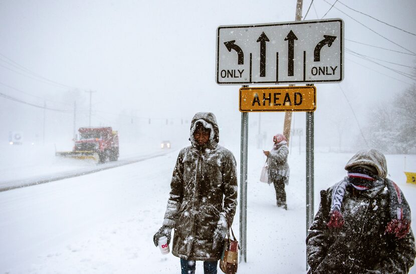 Charville Smith, left, Judy Simmons, center, and Cheryl Rosa stand at a Silver Lane bus...