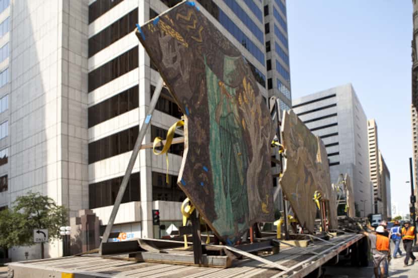 An 18-wheel flatbed truck arrives, mosaics in tow, to the Joule construction site on...