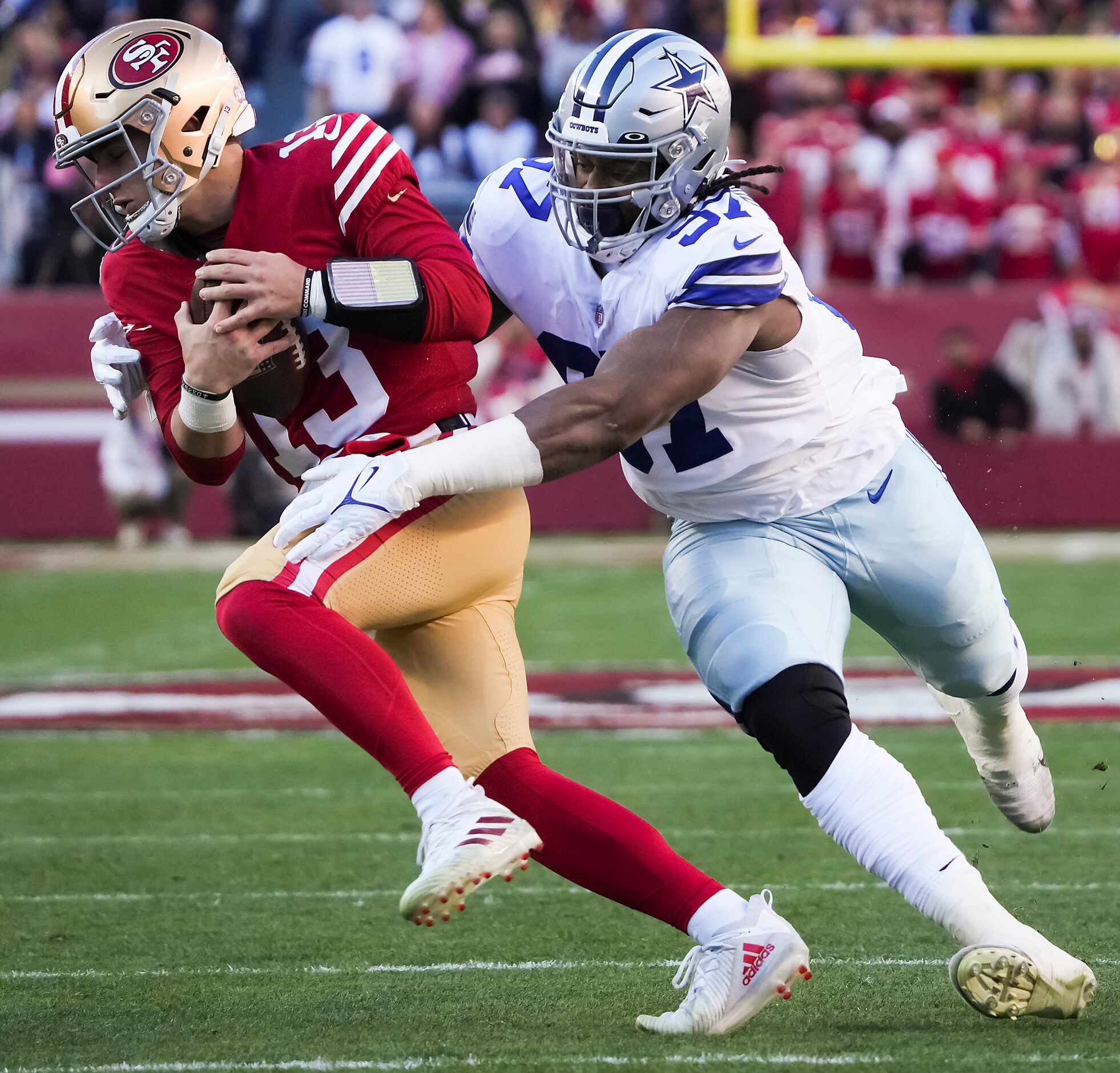 San Francisco 49ers quarterback Brock Purdy (13) is sacked by Dallas Cowboys defensive...