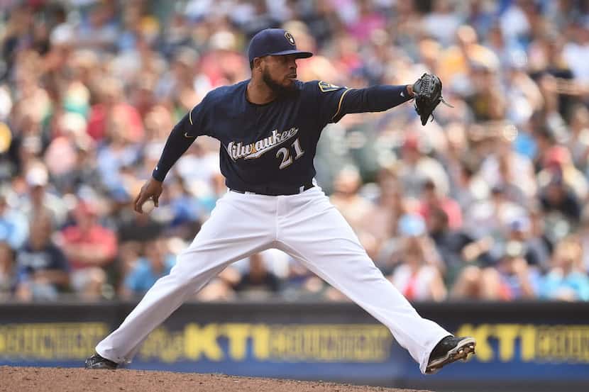 MILWAUKEE, WI - JULY 10:  Jeremy Jeffress #21 of the Milwaukee Brewers throws a pitch during...