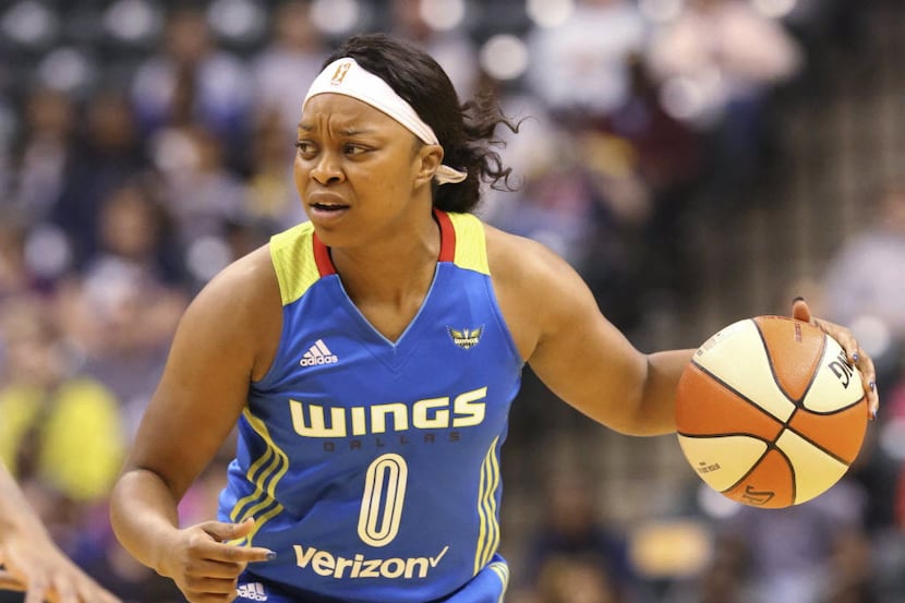 Dallas Wings' Odyssey Sims looks for a teammate to pass to during the team's WNBA basketball...